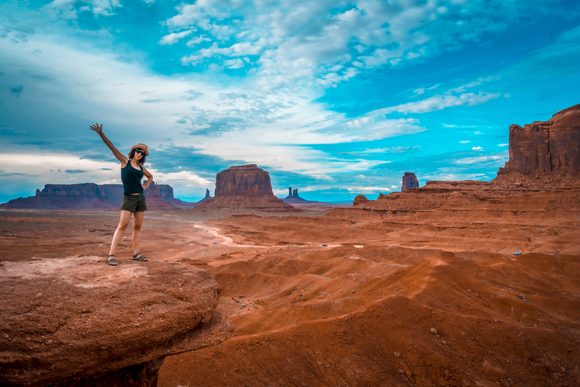 A lady poses for a photo at Monument Valley USA