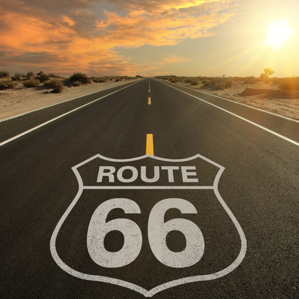 A route 66 sign on the road of the route 66 in USA